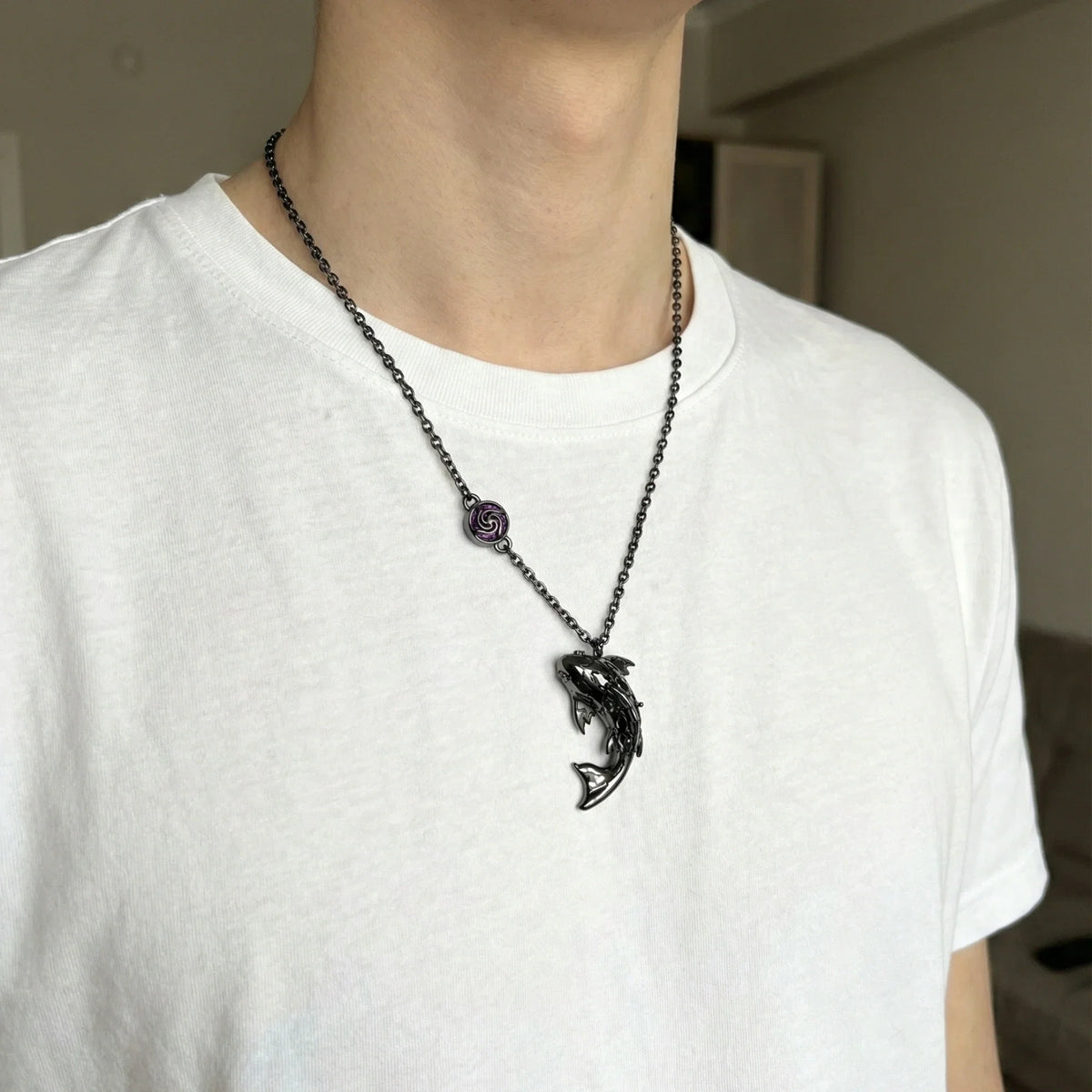 A Kraymer Art koi necklace worn as part of an everyday outfit