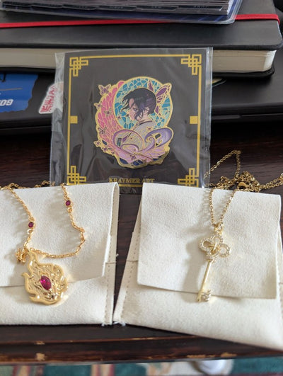 Two Kraymer necklaces and a pin, from a customer’s review