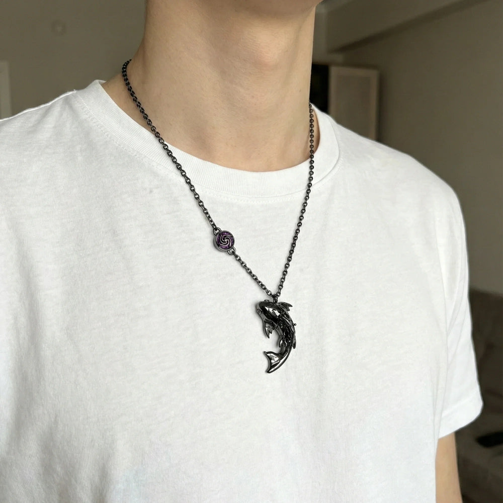 A Kraymer Art koi necklace worn as part of an everyday outfit