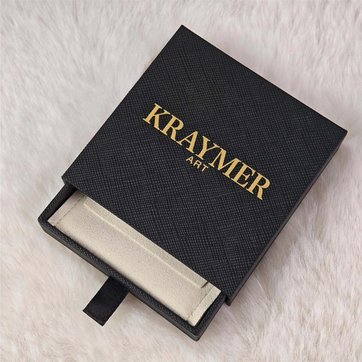 Black vegan leather jewelry gift box with gold-tone foil stamping, by Kraymer Art
