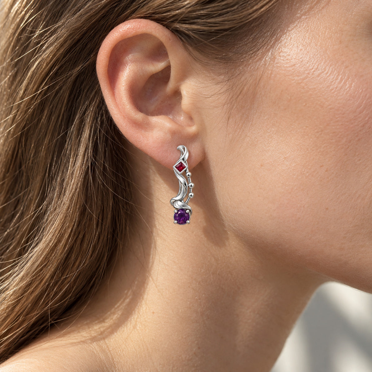 A Thousand Fashions Sash Earrings in silver, worn