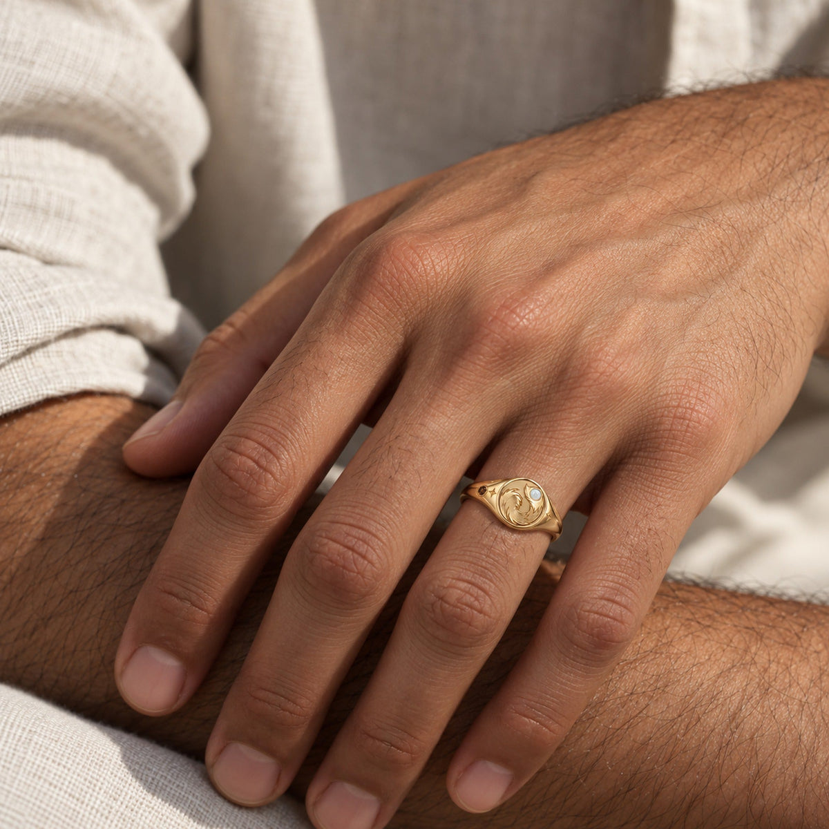 Origin Path Ring in gold, worn by a man