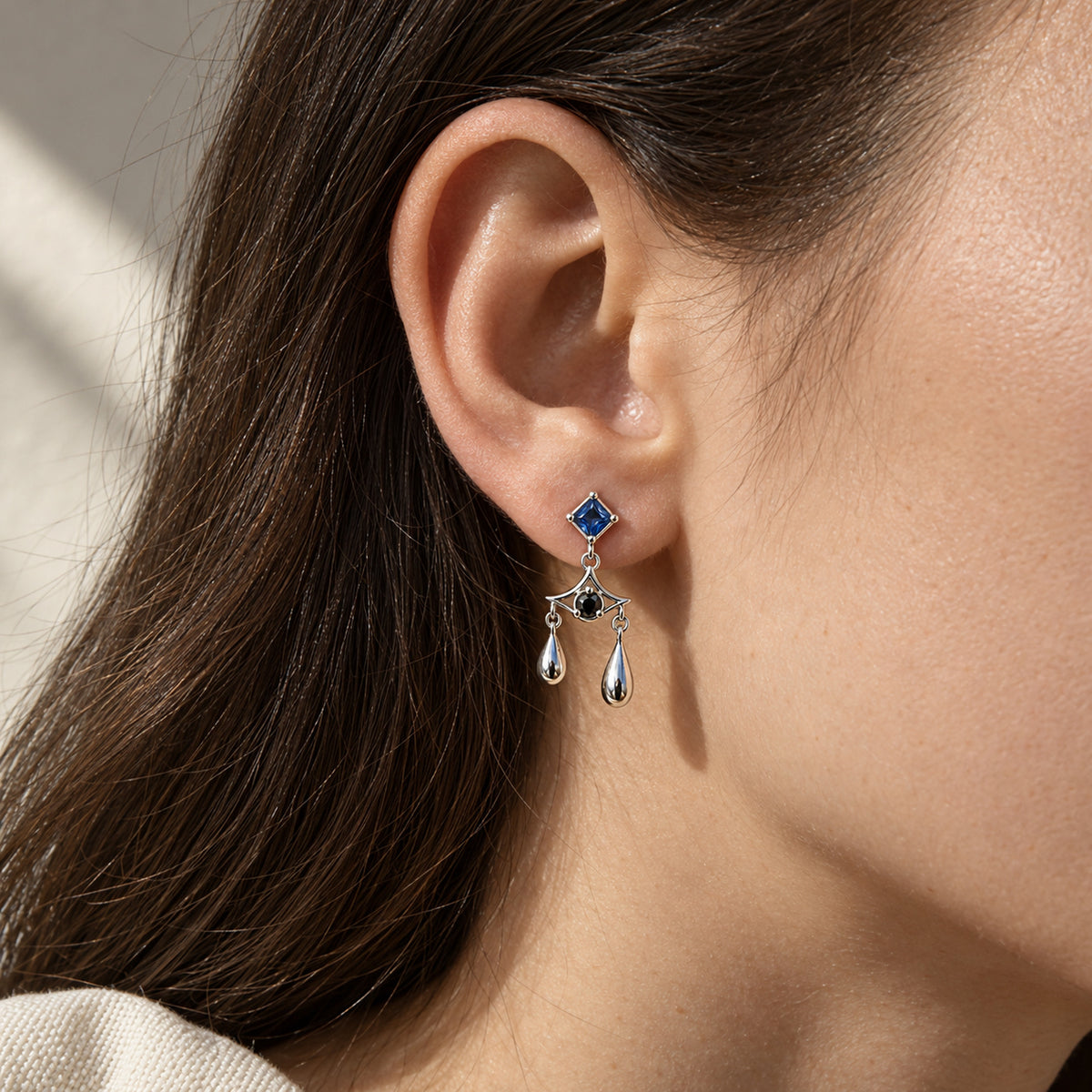 Aura Spike Earrings in silver, worn