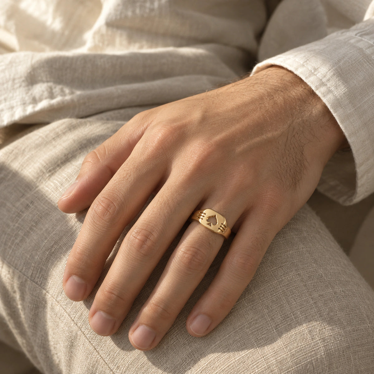 Aventurine Edge of Fortune Ring in gold, worn on a man's hand