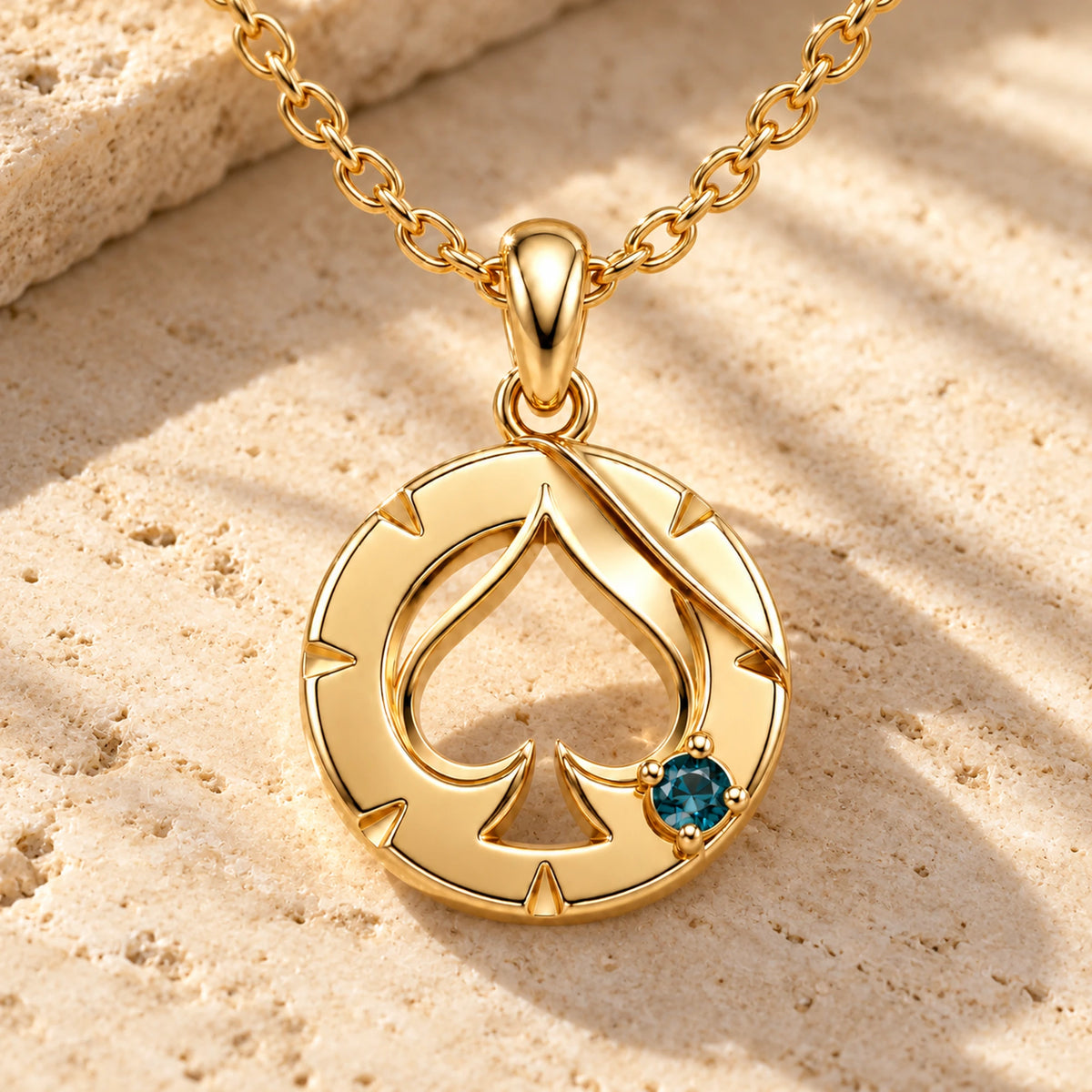 Aventurine House Medallion Necklace in gold, on warm stone in daylight