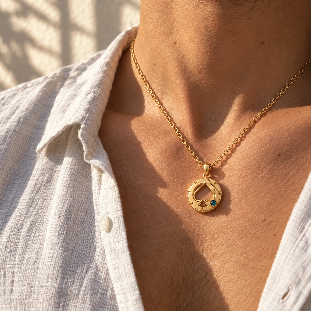Aventurine House Medallion Necklace in gold, worn by a man
