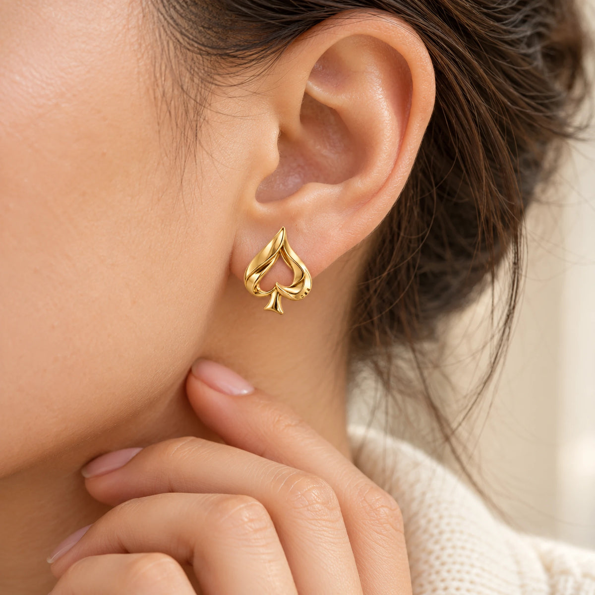 Aventurine Silent Tell Earrings in gold, worn at the ear