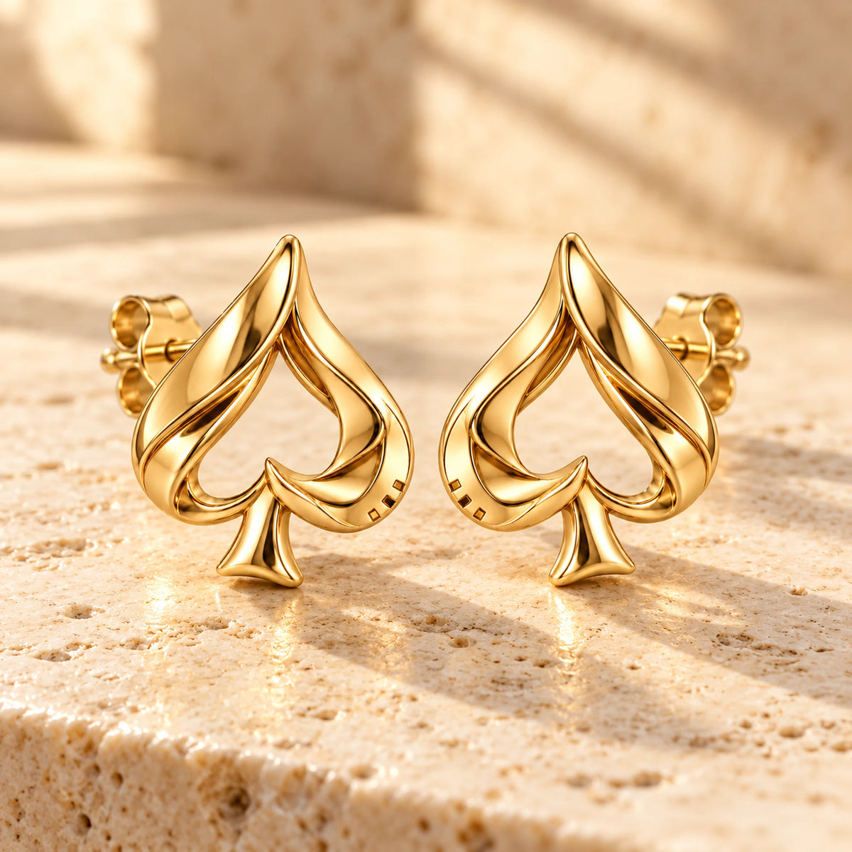 Aventurine Silent Tell Earrings in gold, on warm stone in daylight