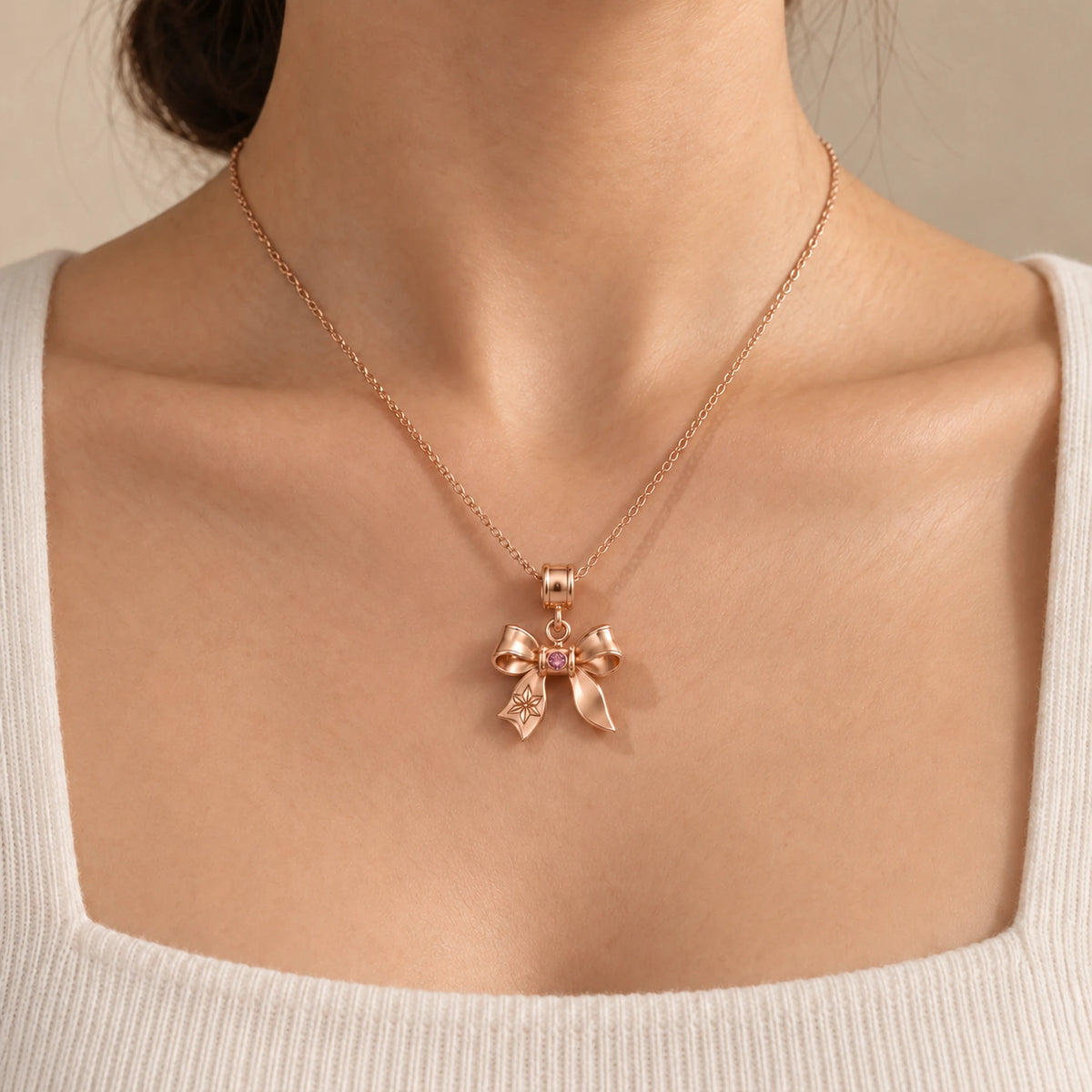 Bamboo Demon Charm in rose gold, worn on a fine chain as a pendant
