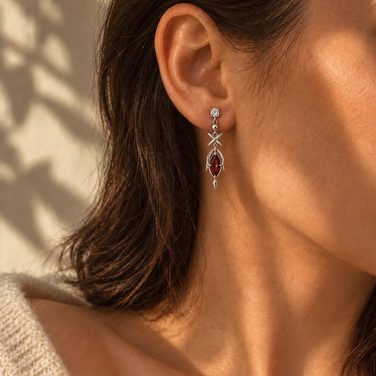Black Swan Earrings in silver, worn