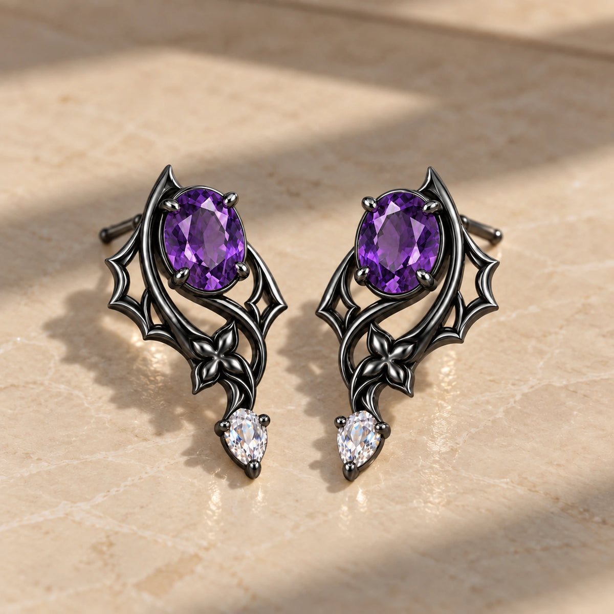 Black Swan Memoria Earrings in Royal Black on marble in window light