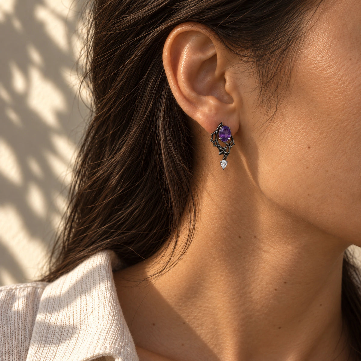 Black Swan Memoria Earrings in Royal Black worn