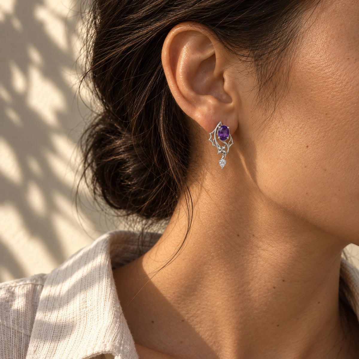 Black Swan Memoria Earrings in silver worn