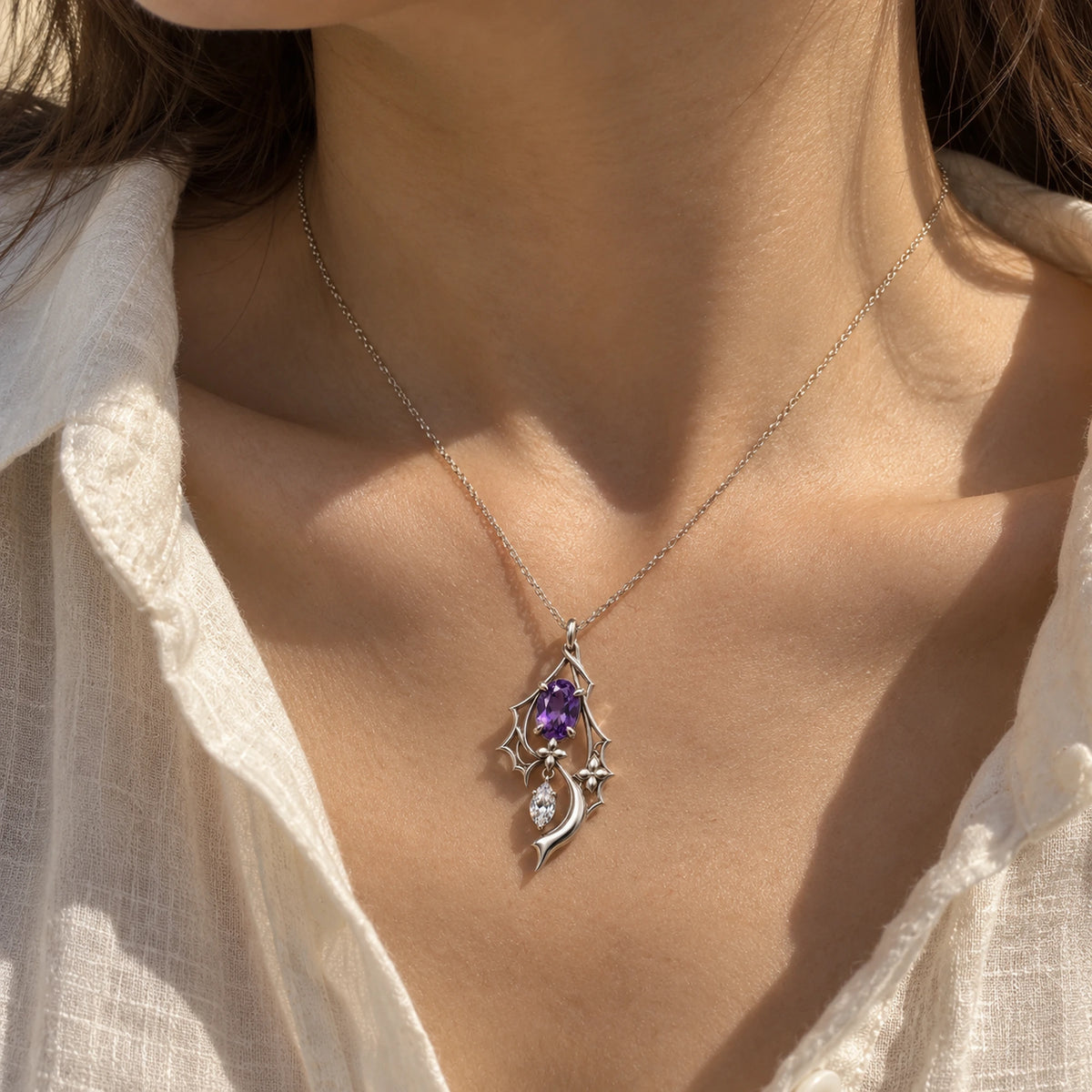 Black Swan Memoria Necklace in silver worn at the collarbone
