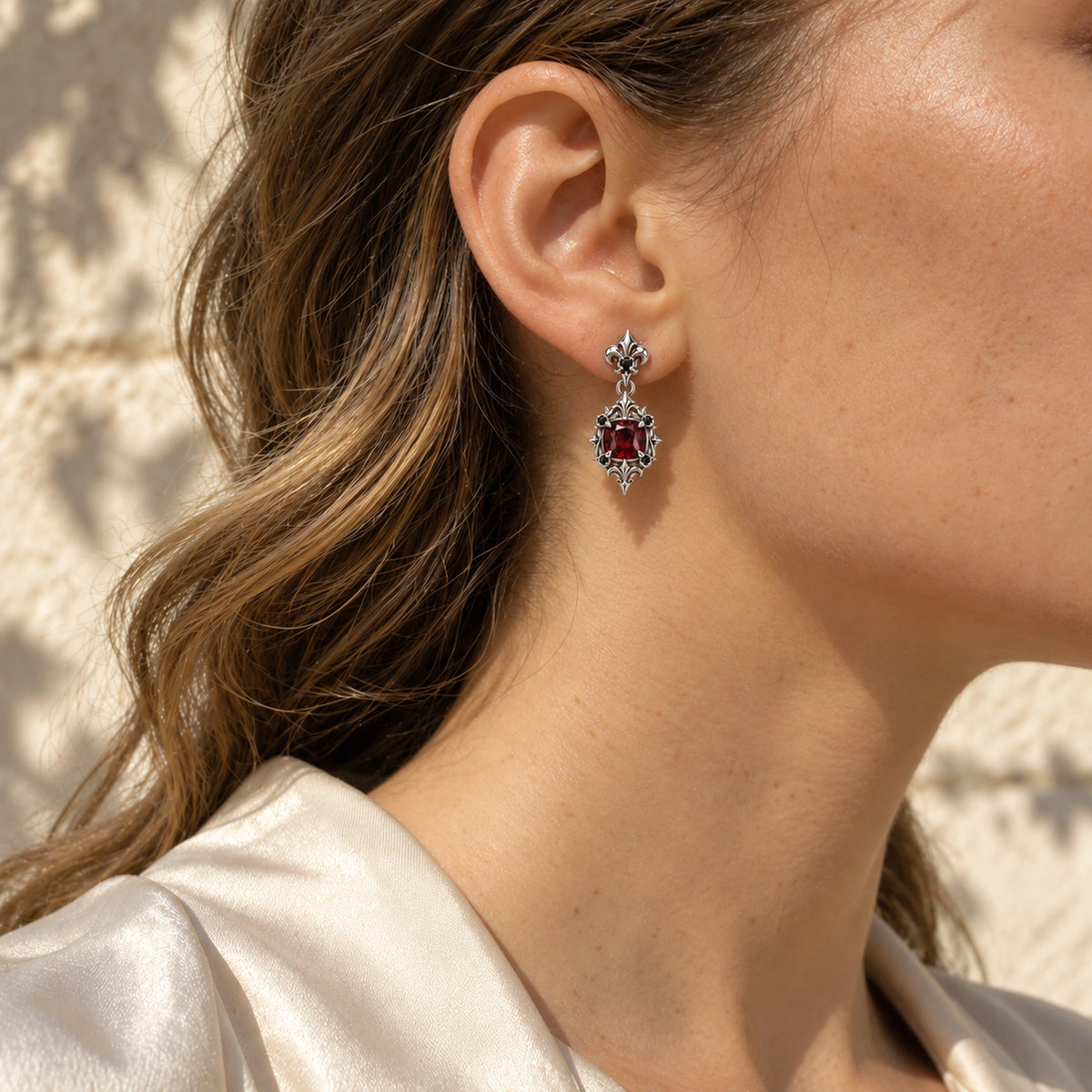 Borgia Drop Earrings in Silver, worn
