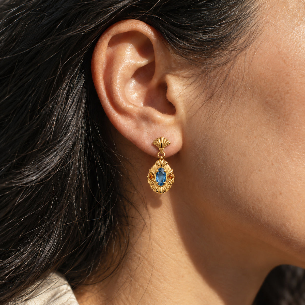 Bubble Shell Earrings in gold, worn