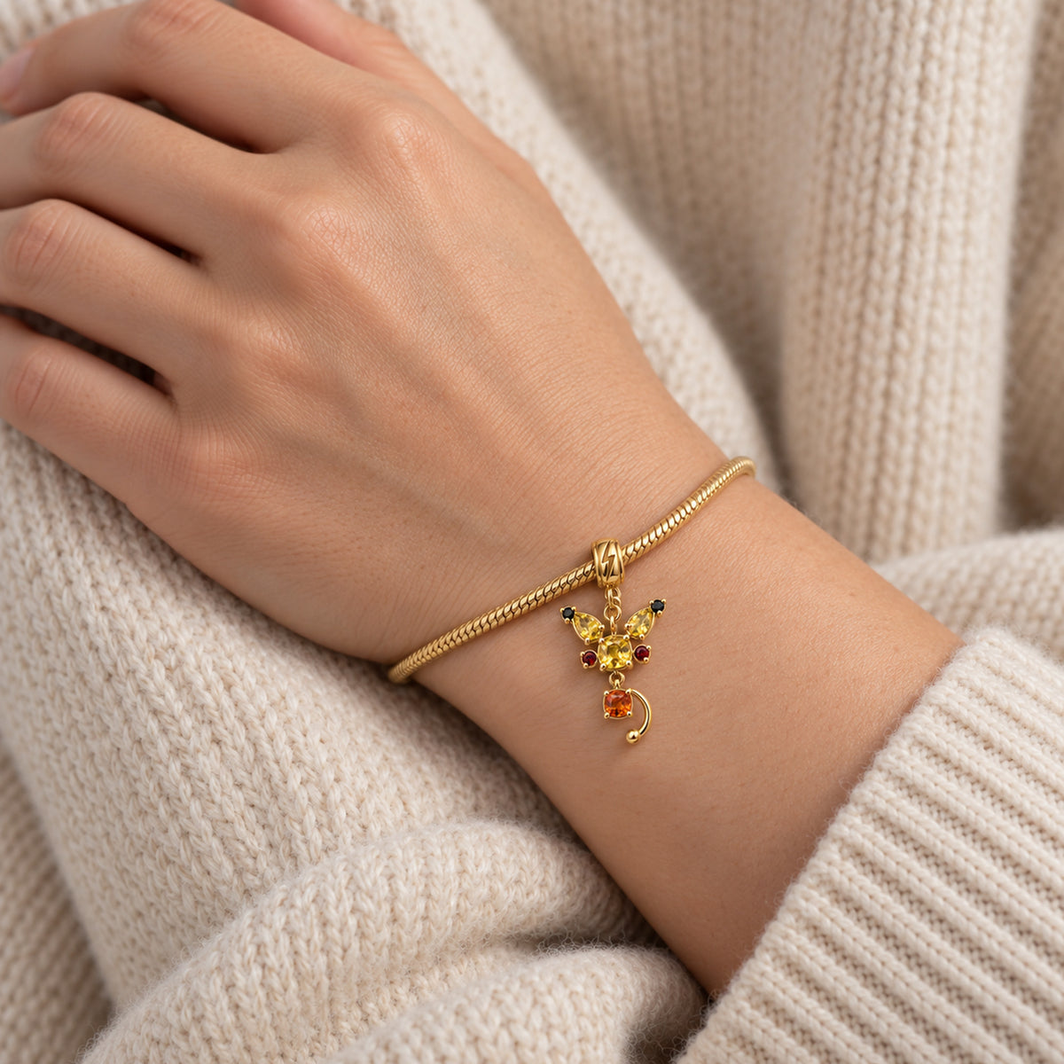 Cheek Spark Charm in gold, worn