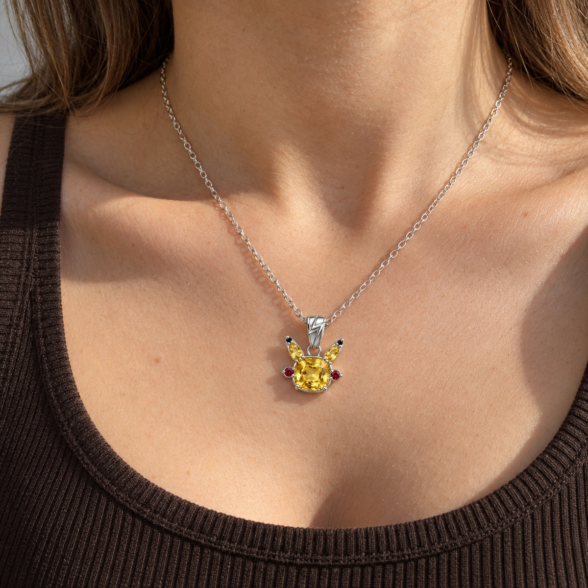 Cheek Spark Necklace in silver, worn