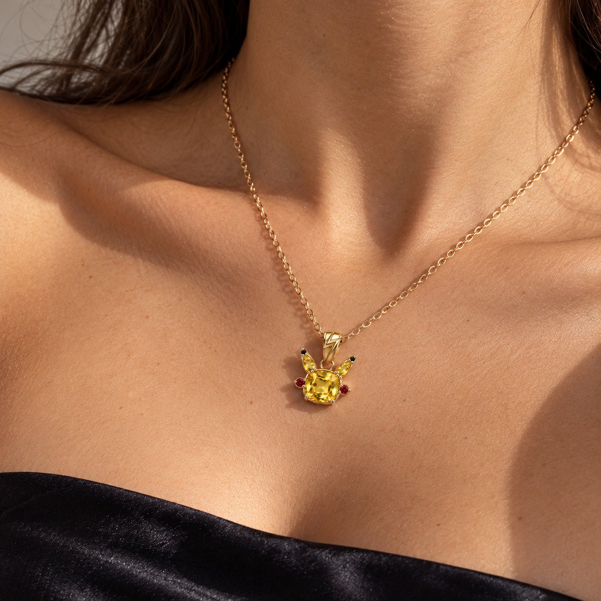 Cheek Spark Necklace in gold, worn