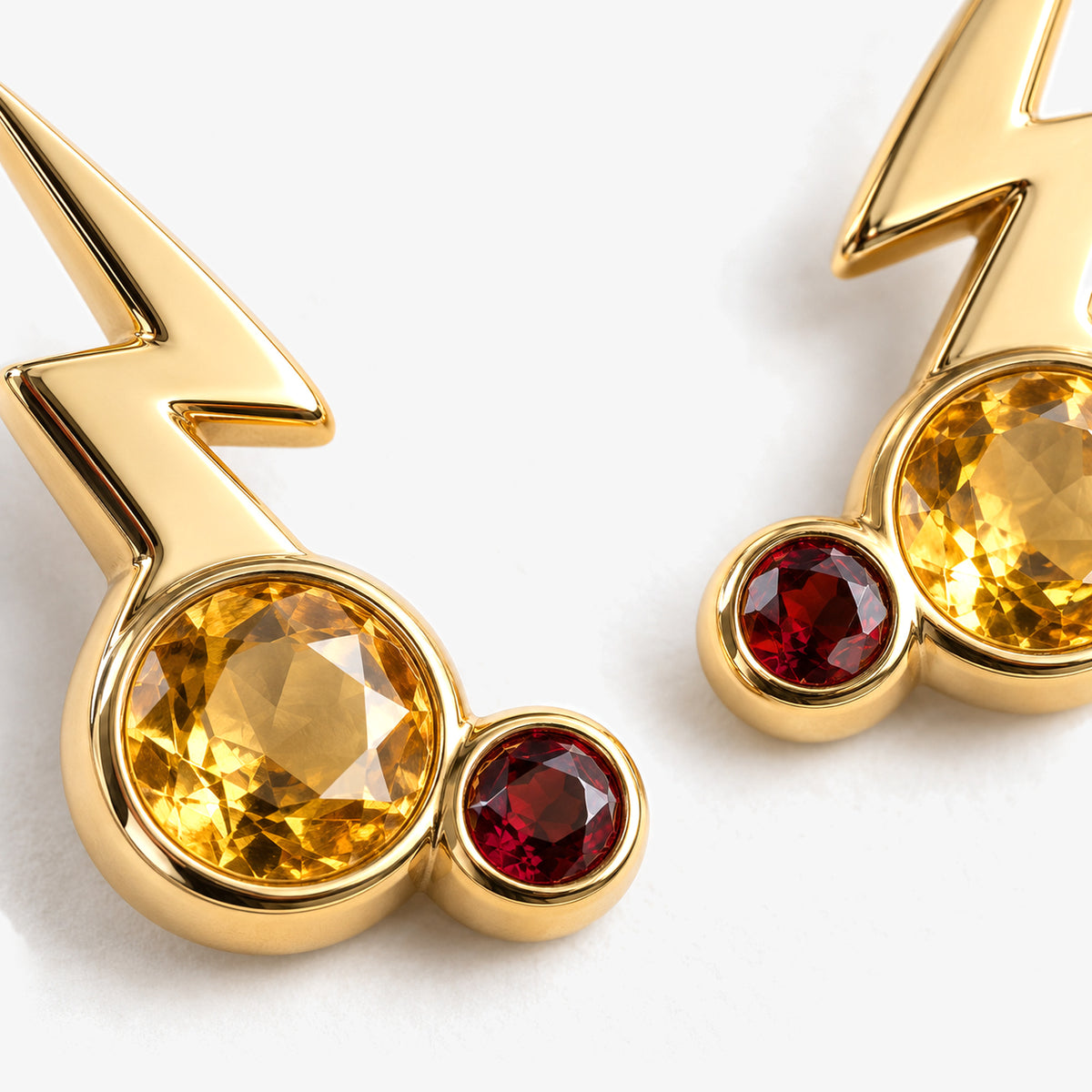 Cheek Spark Studs in gold, close-up