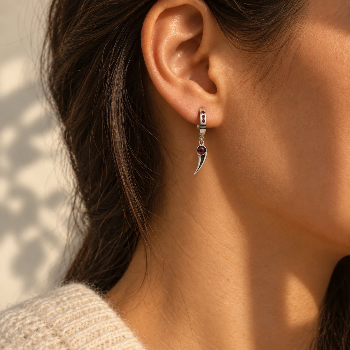 Choso Earrings in silver, worn