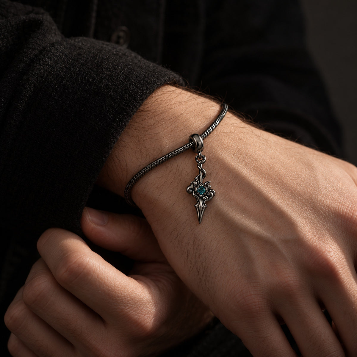 Dan Heng Cloud-Piercer Charm in Royal Black, on a Royal Black charm bracelet on a man's wrist