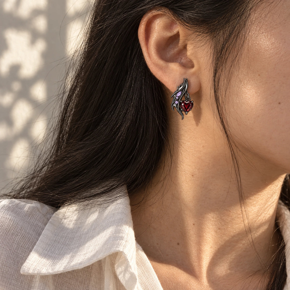 Durin Earrings in black worn on the ear