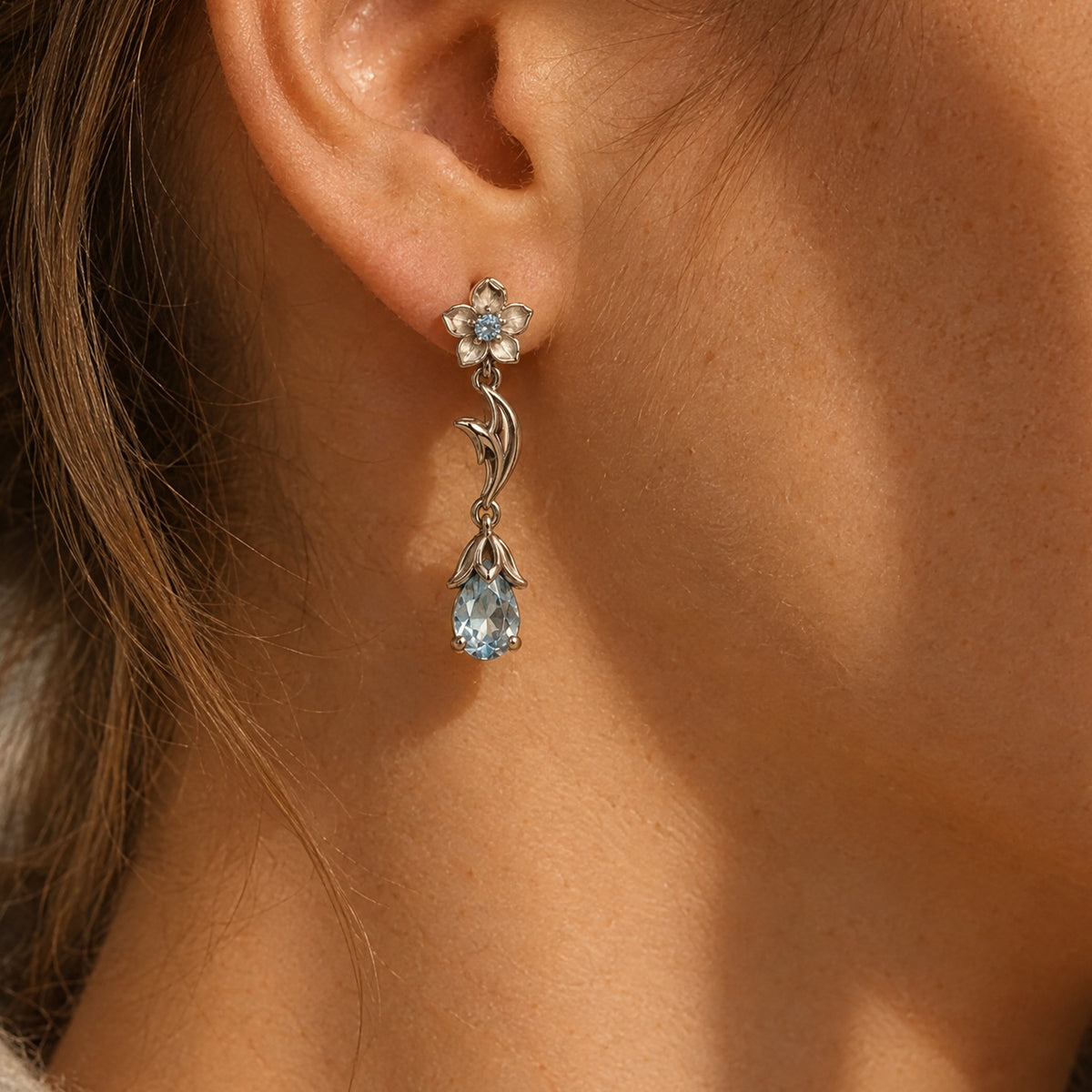 Ganyu Earrings in silver worn on the ear