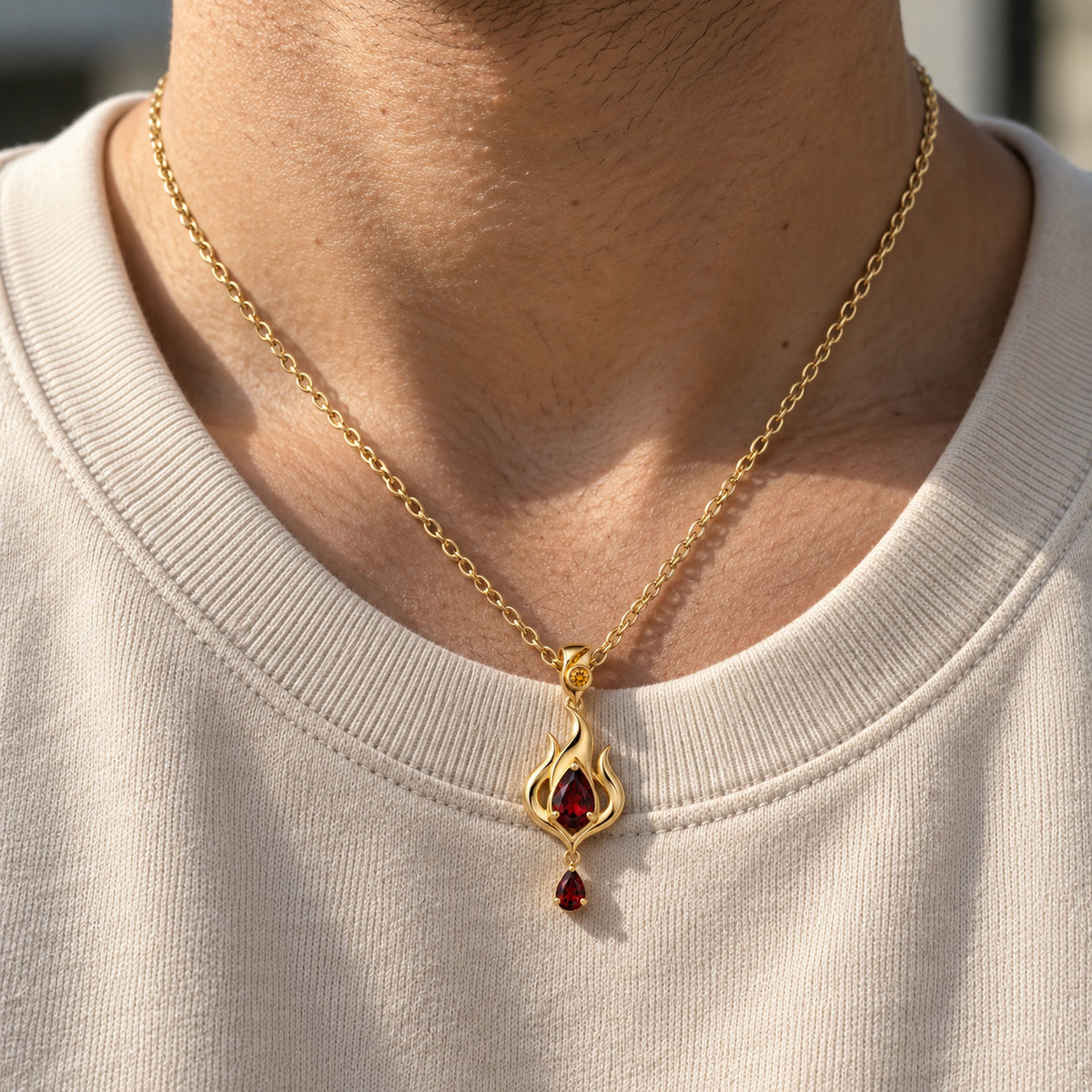 Fire Nation Drop Necklace in gold, worn on a man