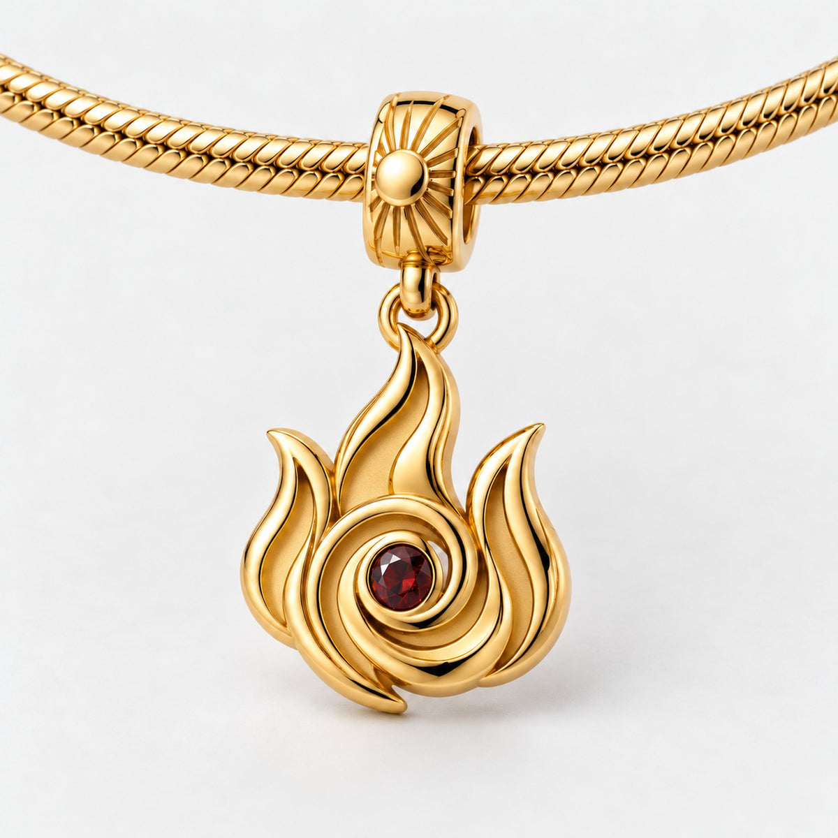 Fire Nation Flame Charm in gold, on a charm bracelet