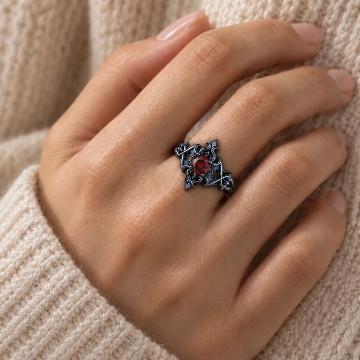Crimson Fleur Cross Ring in Royal Black, worn on the hand