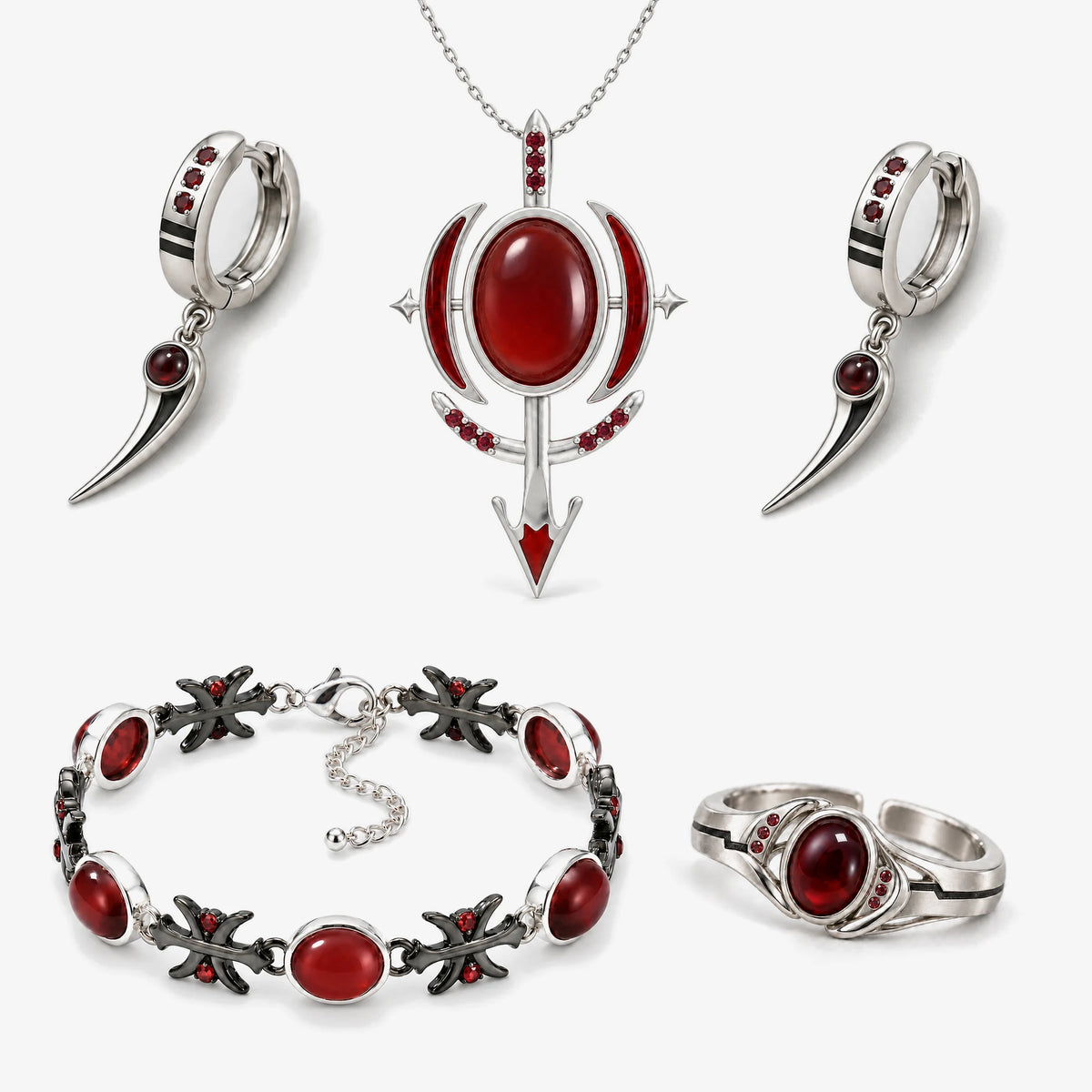 Full Blood Manipulation Jewelry Collection in silver: arrow pendant necklace, blade drop huggie earrings, cross link bracelet and ring with red stones