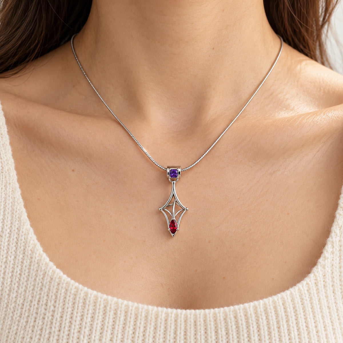 The free second Kafka Little Strand Charm worn on a simple silver chain necklace (chain not included)