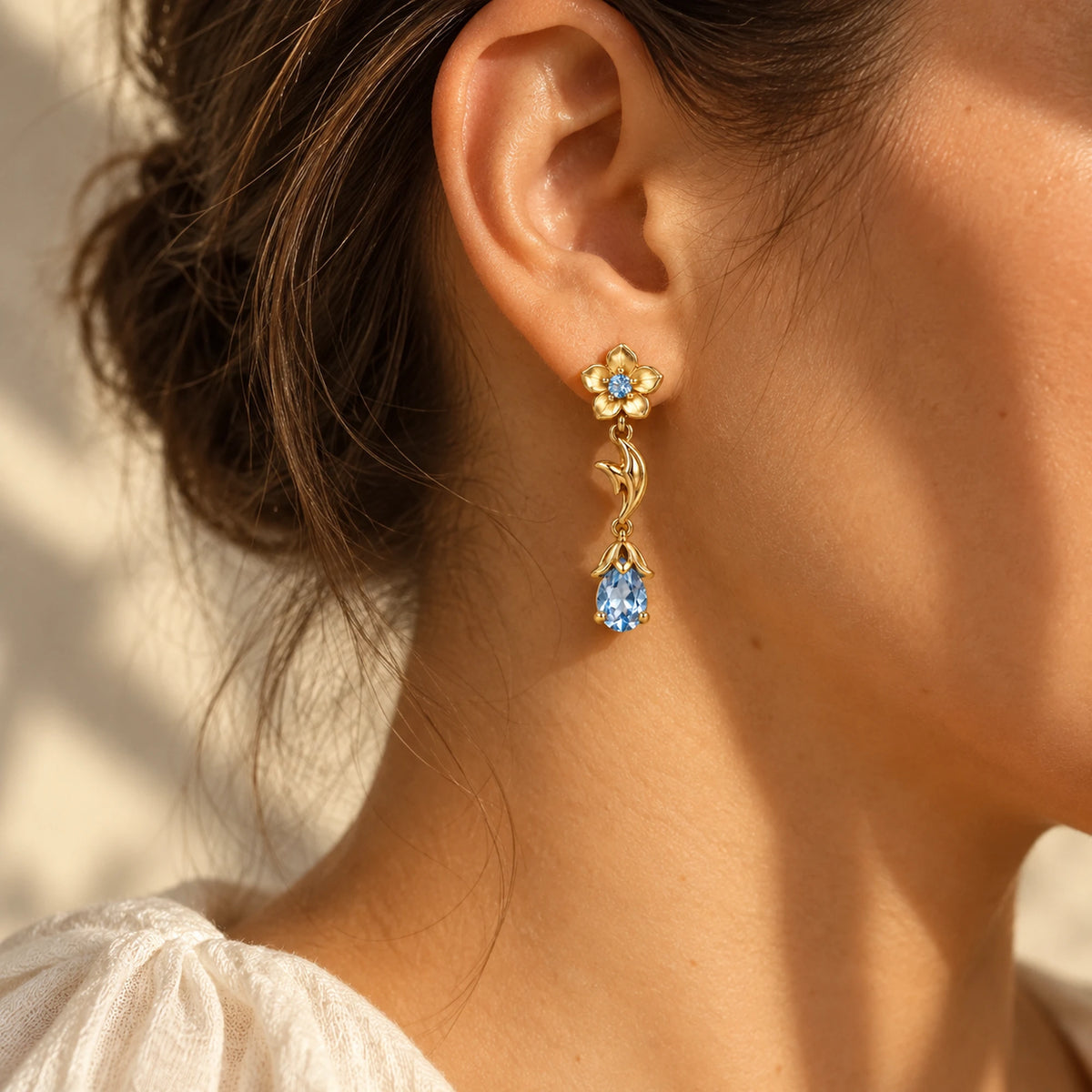 Ganyu Earrings in gold worn on the ear