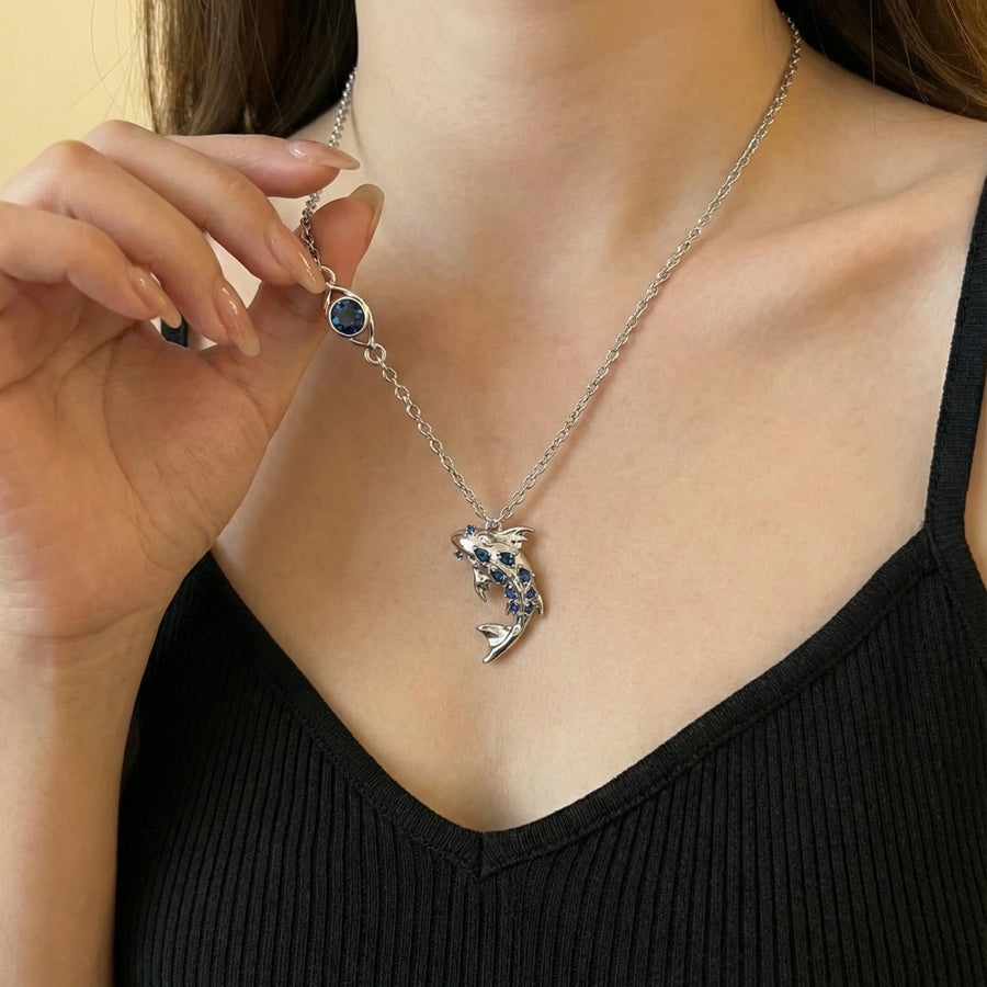 Silver koi necklace worn on a model