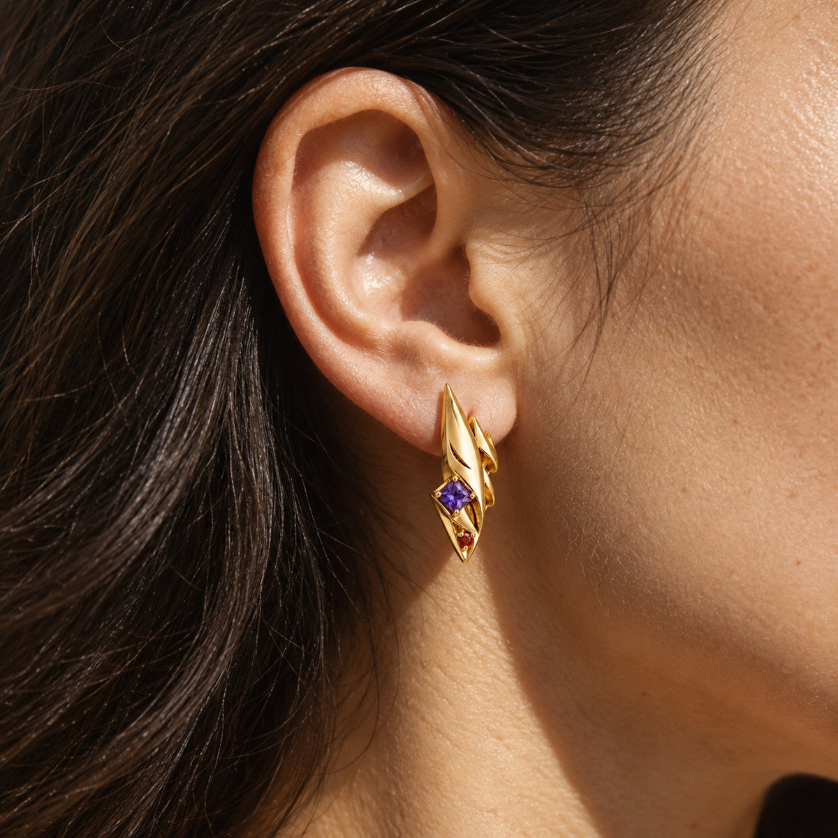 Grin Shade Studs in gold, worn