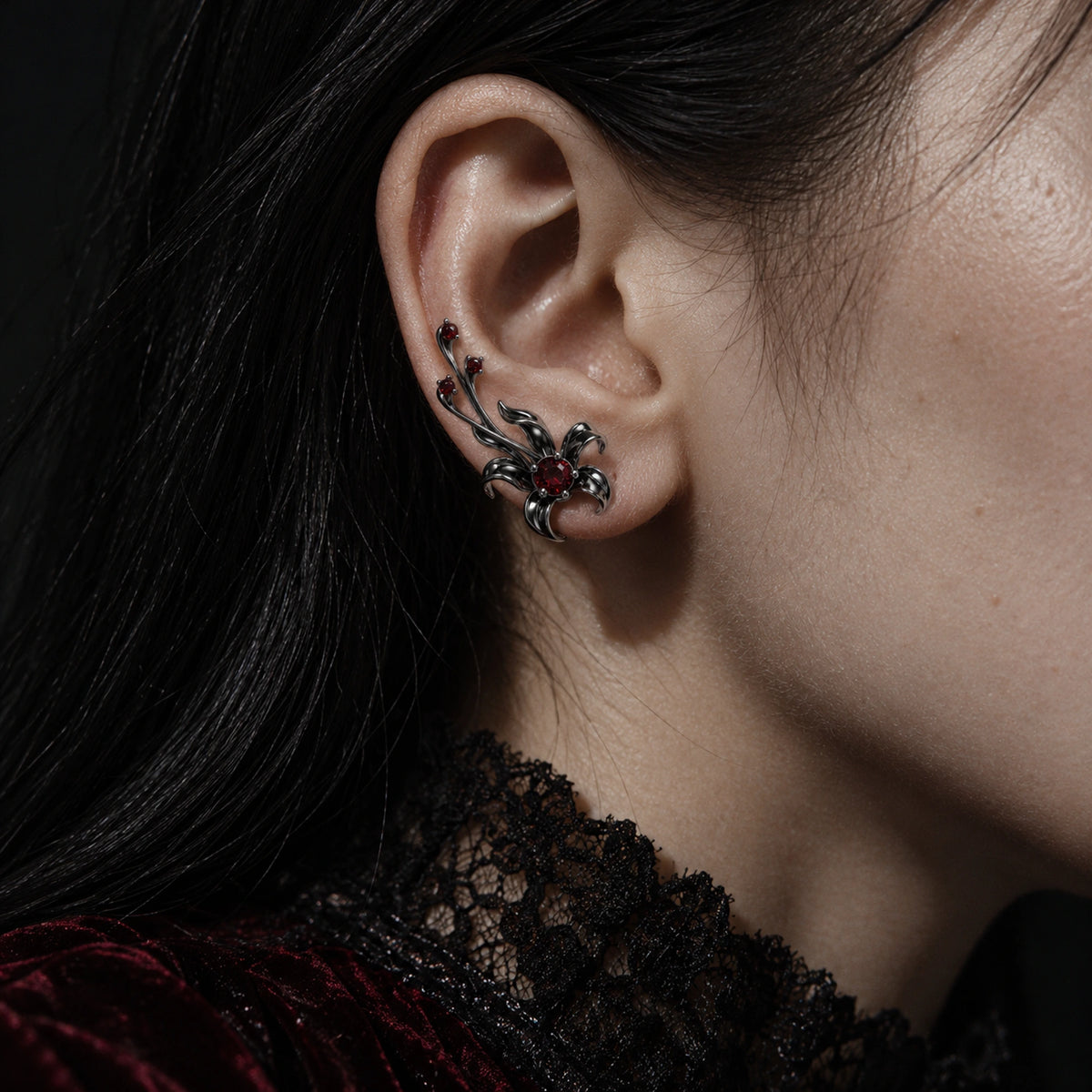 Infinity Castle Ear Climbers in Royal Black, worn on the ear