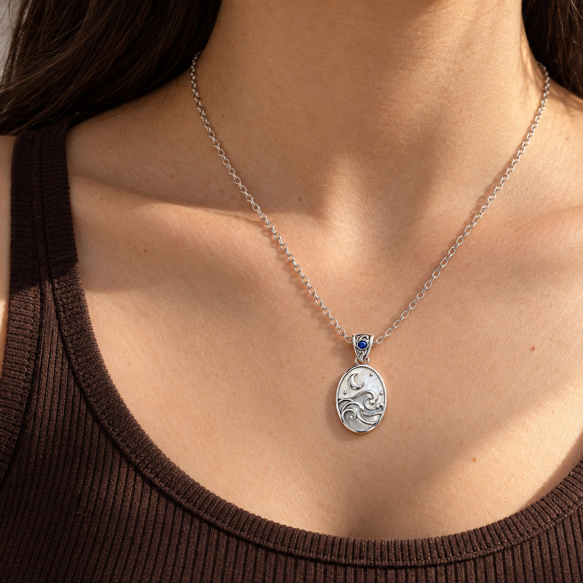 Inherited Tide Moon Necklace in silver, worn