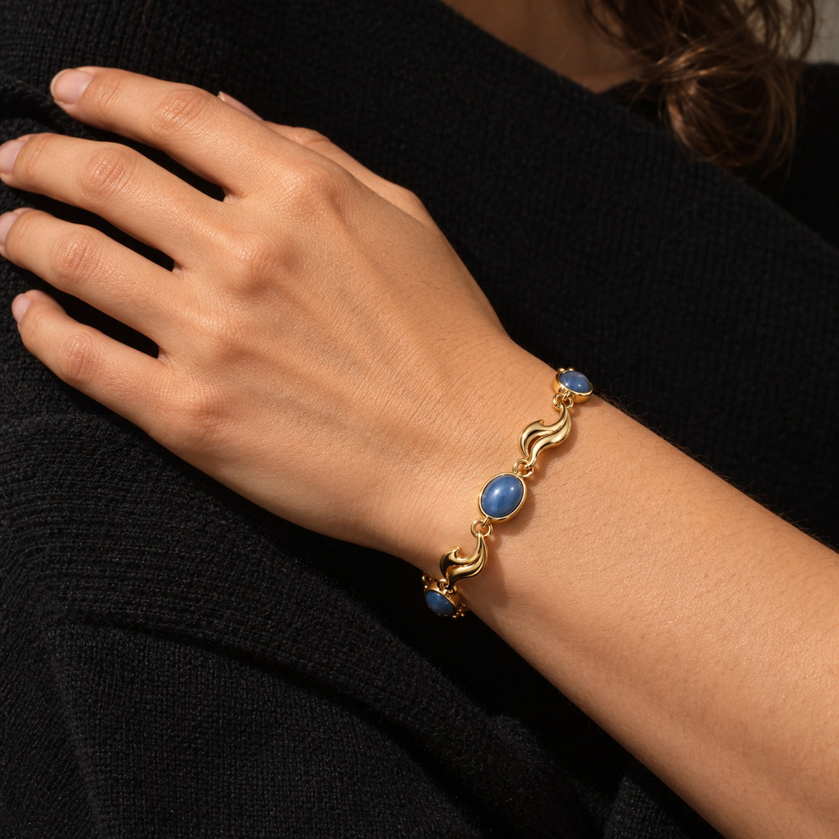 Inherited Tide Wave Bracelet in gold, worn