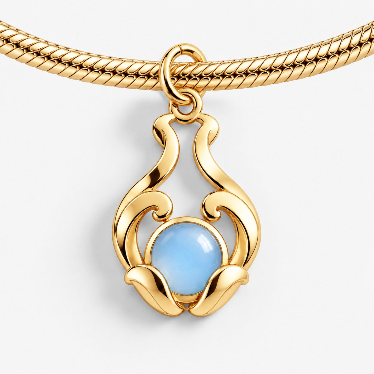 Water Nation Heirloom Charm in gold, on a charm bracelet