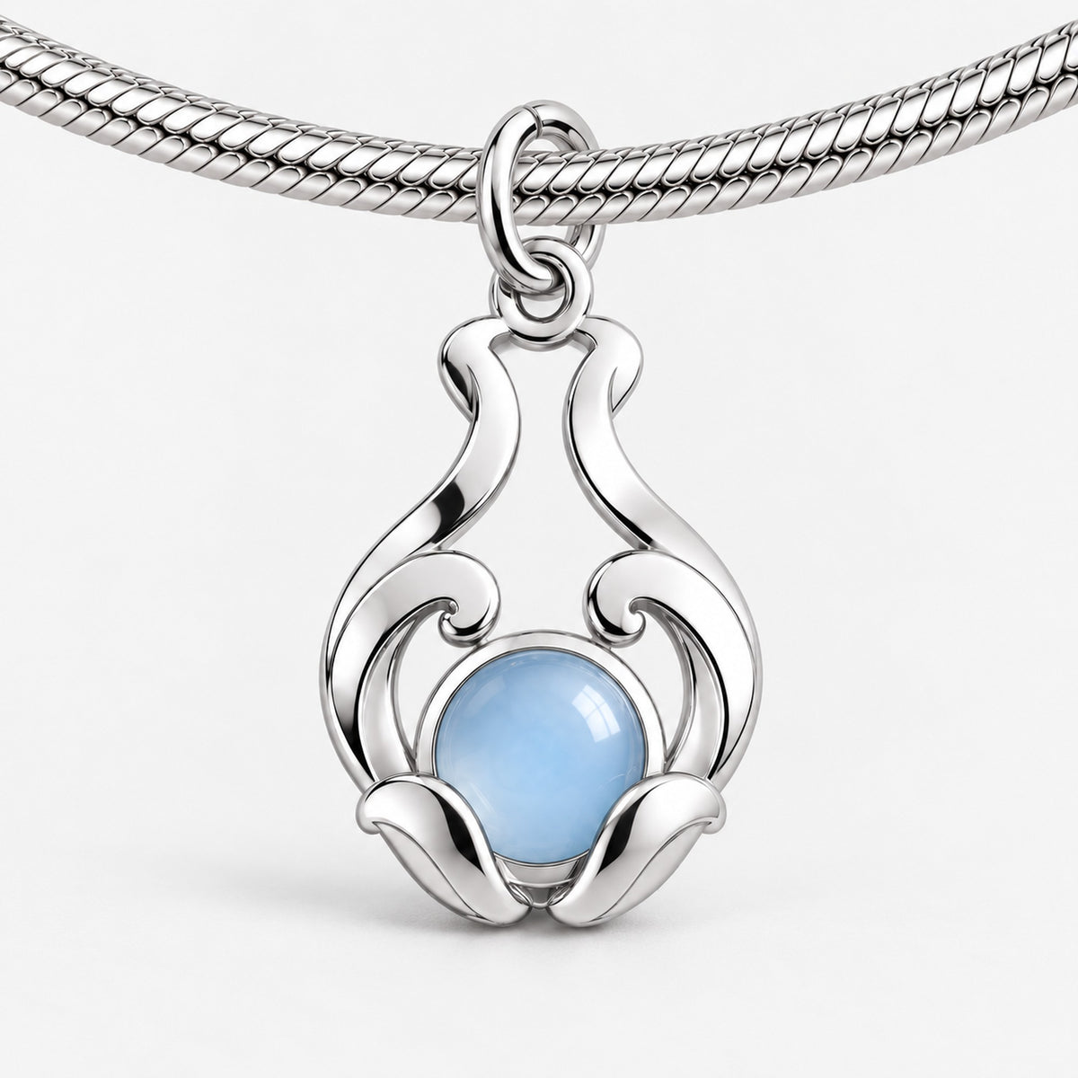 Water Nation Heirloom Charm in silver, on a charm bracelet