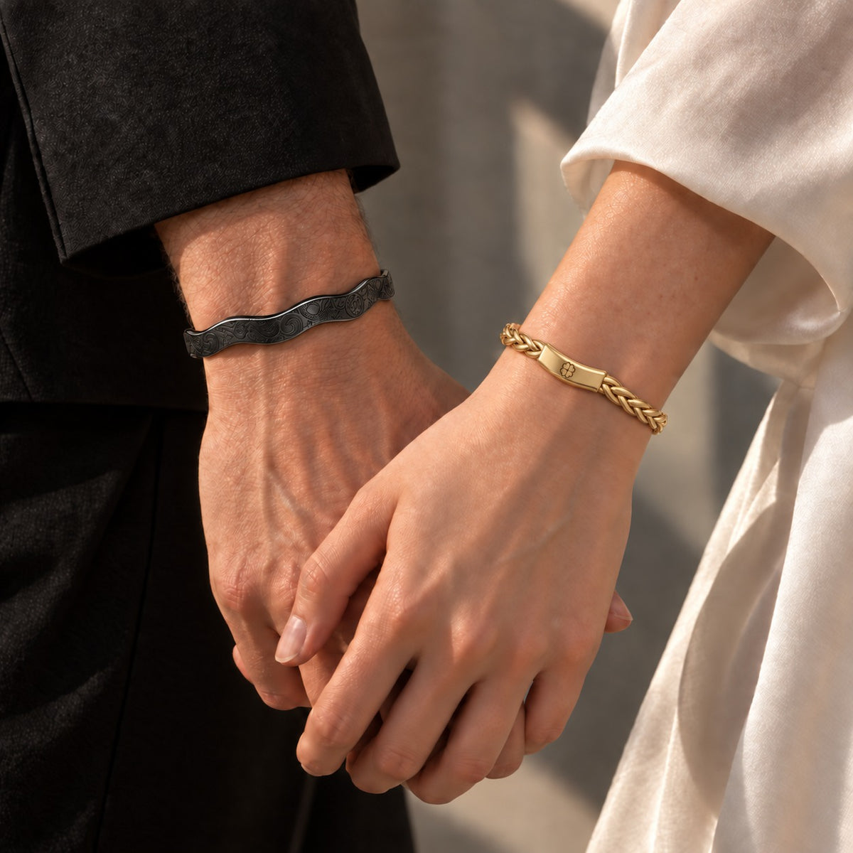 A couple holding hands, wearing the Serpent Hashira and Love Hashira bracelets