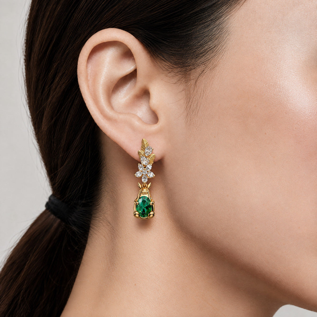 The Forest Spirit Earrings in gold, worn