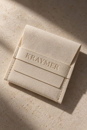 The hand-stitched suede pouch
