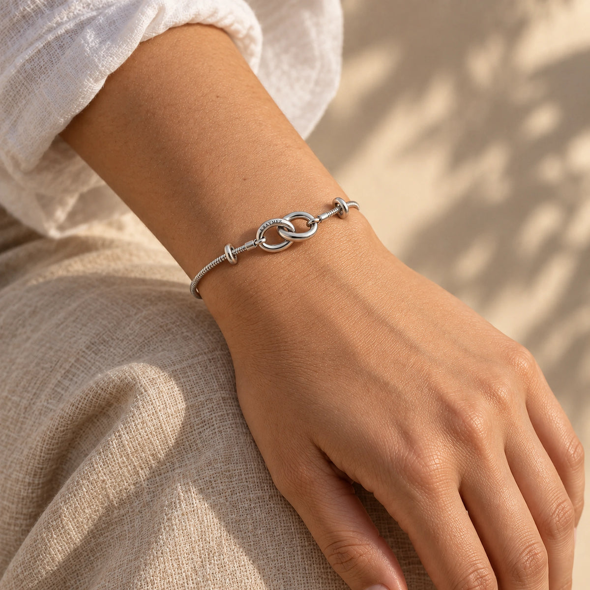 Kraymer Charm Bracelet in silver, worn