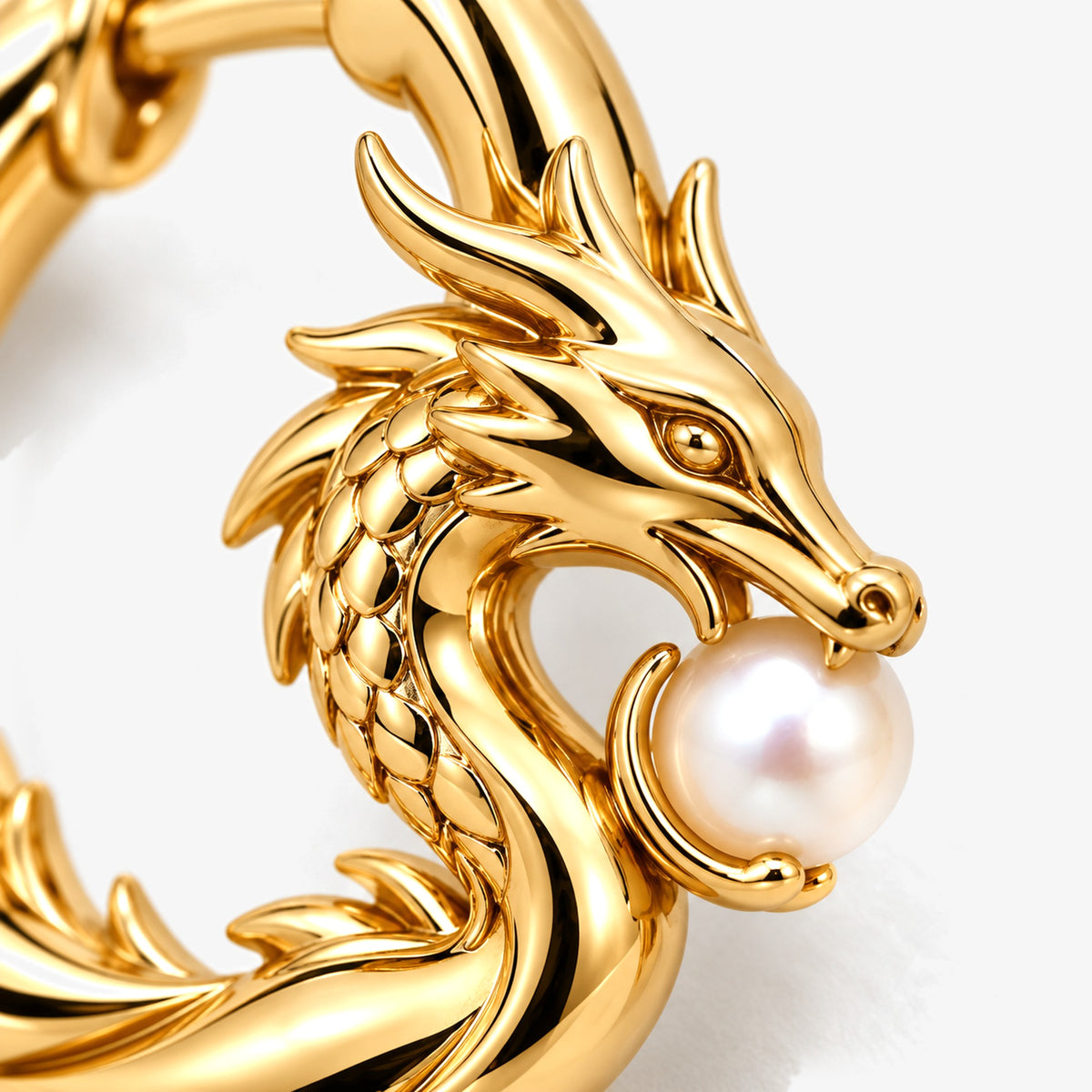 Lotus Tea Dragon Huggies in gold, close-up