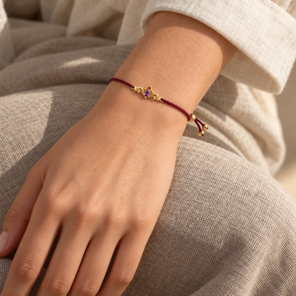 Loulan Cord Bracelet in gold, worn on the wrist