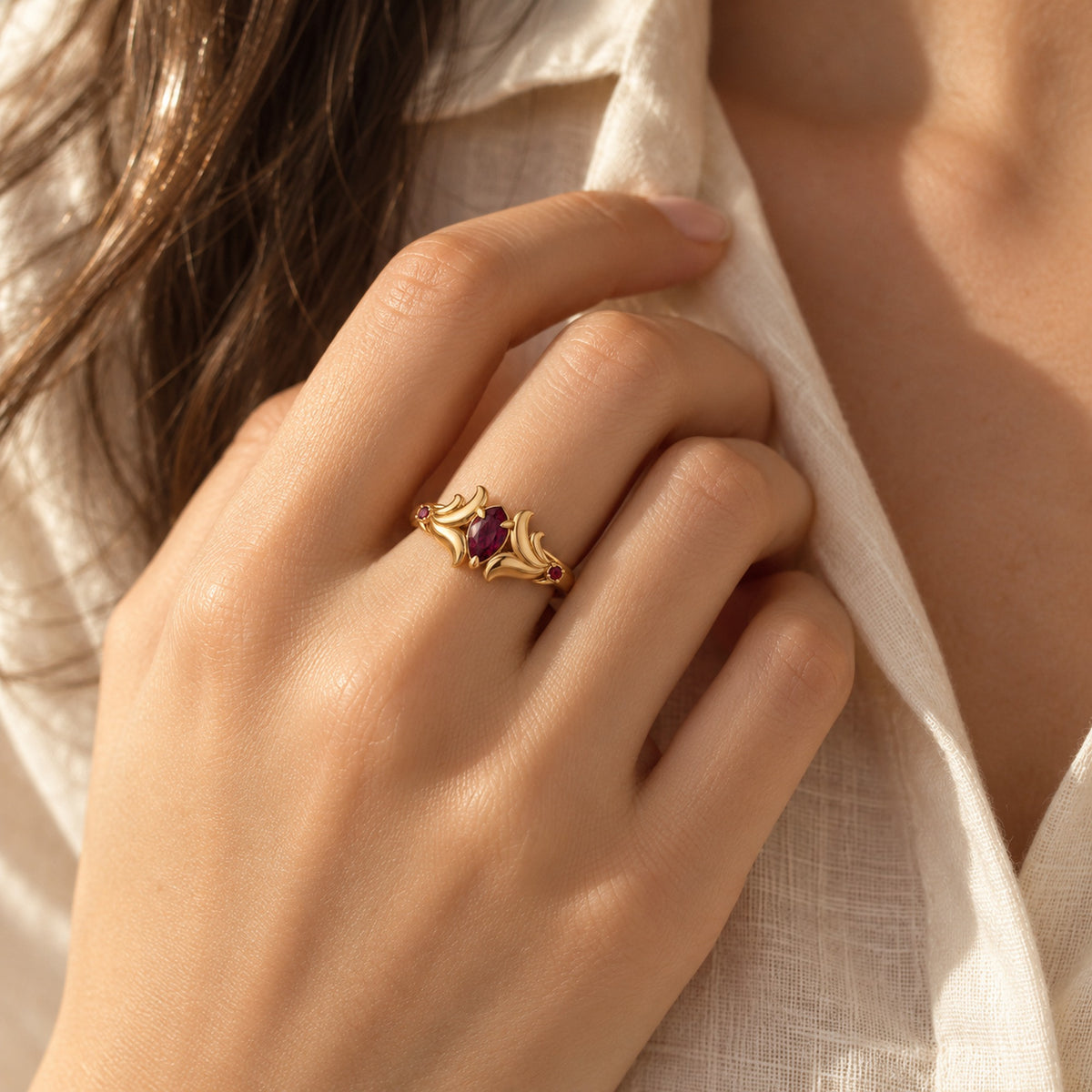 Loulan Crest Ring in gold, worn on the hand