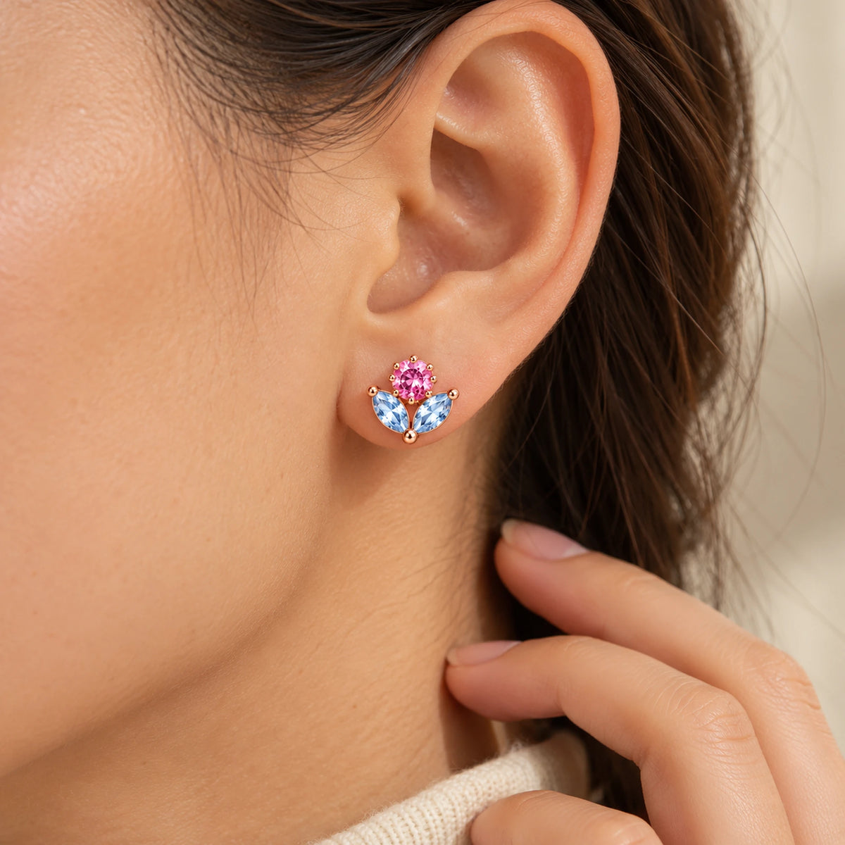 March 7th Ice Flower Earrings in rose gold, worn at the ear