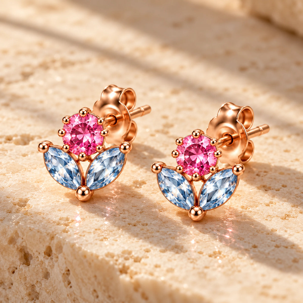 March 7th Ice Flower Earrings in rose gold, on warm stone in daylight